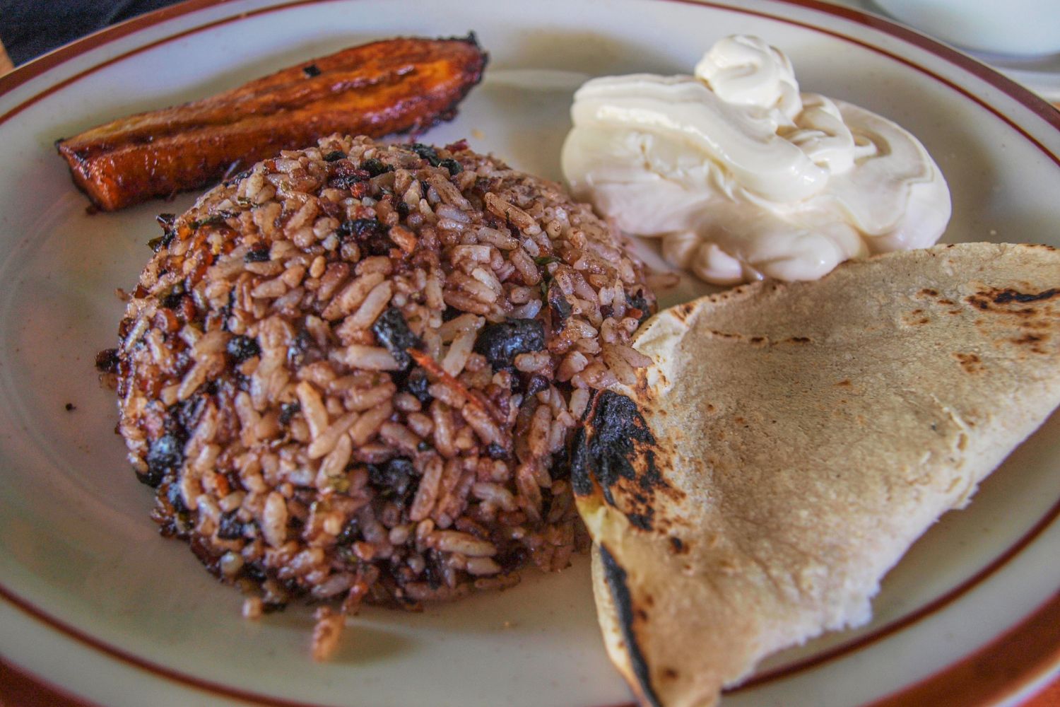 gallo pinto with fresh tortilla, sour cream and plantain